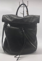 
              Black soft backpack with silver zipper
            