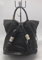 Black soft backpack with silver zipper