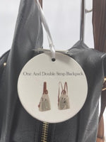 Black backpack with brown double straps