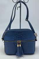
              Denim blue mid-sized handbag with Alligator print
            