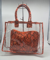 
              Clear tote with orange snakeskin bag
            