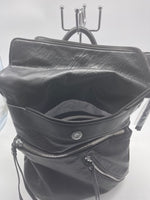
              Black soft backpack with silver zipper
            